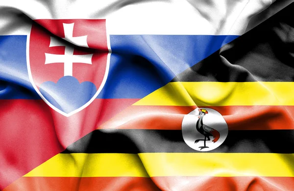 Uganda och Slovakien viftande flagga — Stockfoto