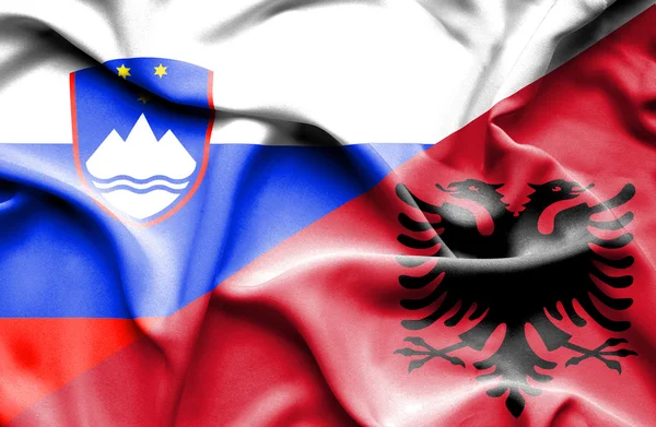 Waving flag of Albania and Slovenia — Stock Photo, Image