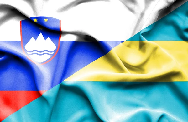 Vlající vlajka Baham a Slovinsko — Stock fotografie