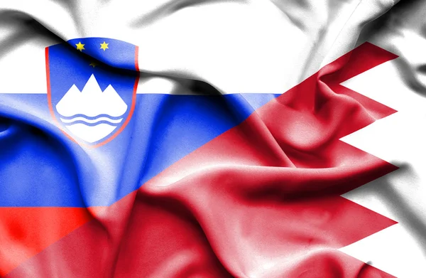 Waving flag of Bahrain and Slovenia — Stock Photo, Image