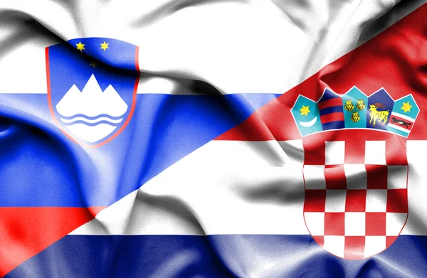 Macha flagą Chorwacja i Słowenia — Zdjęcie stockowe