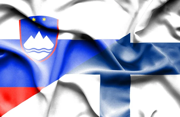 Waving flag of Finland and Slovenia — Stock Photo, Image