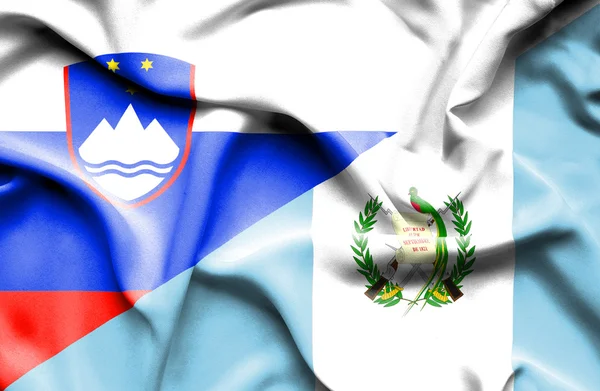 Vlající vlajka Guatemaly a Slovinsko — Stock fotografie