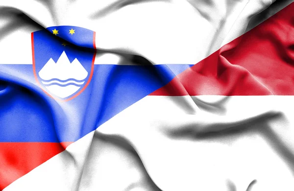 Waving flag of Indonesia and Slovenia — Stock Photo, Image