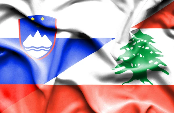 Libanon és Szlovénia hullámzó zászlaja — Stock Fotó