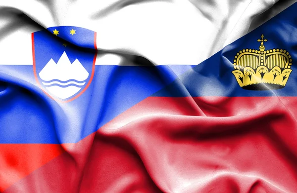 Waving flag of Lichtenstein and Slovenia — Stock Photo, Image