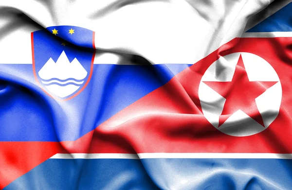 Nordkorea och Slovenien viftande flagga — Stockfoto