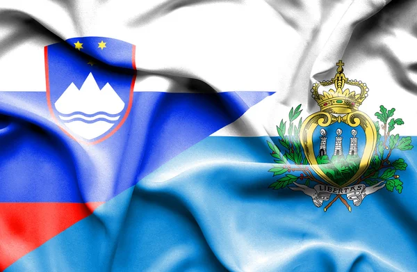San marino és Szlovénia hullámzó zászlaja — Stock Fotó
