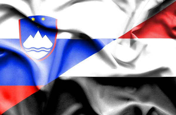 Flagge des Jemen und Sloweniens schwenken — Stockfoto
