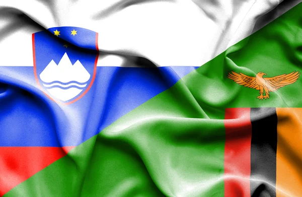Waving flag of Zimbabwe and Slovenia — Stock Photo, Image