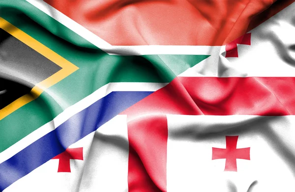 Viftande flagga Georgien och Sydafrika — Stockfoto