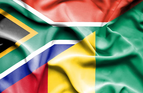 Vlající vlajka Guiney a Jižní Afrika — Stock fotografie