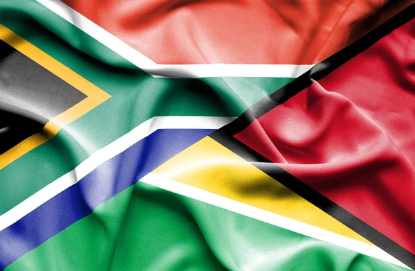 Waving flag of Guyana and South Africa — Stock Photo, Image