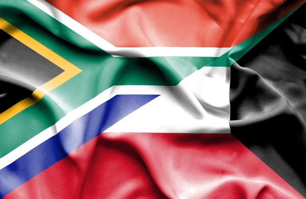 Waving flag of Kuwait and South Africa