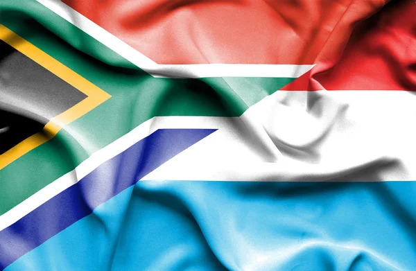 Waving flag of Luxembourg and South Africa — Stock Photo, Image