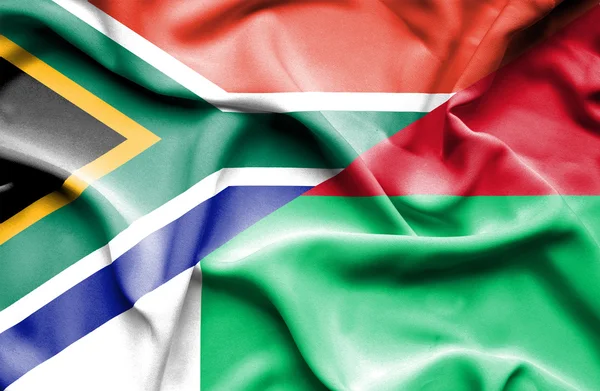 Waving flag of Madagascar and South Africa — Stock Photo, Image