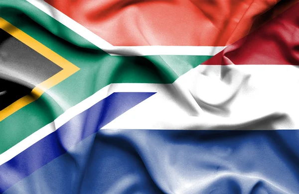 Waving flag of Netherlands and South Africa — Stock Photo, Image