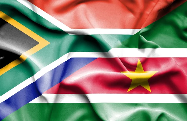 Waving flag of Suriname and South Africa — Stock Photo, Image