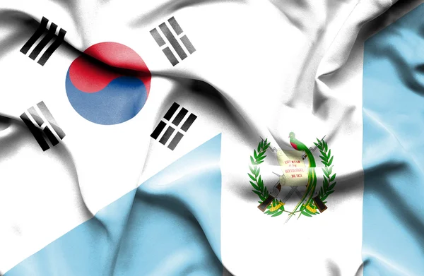 Vifta med guatemala och Sydkorea flagga — Stockfoto