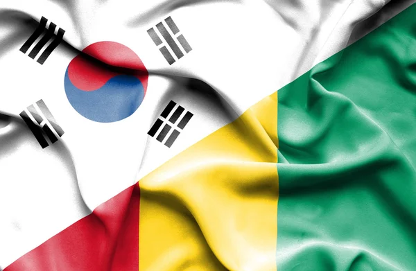 Bandiera sventolante della Guinea e della Corea del Sud — Foto Stock