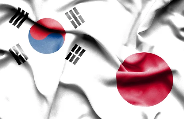 Ondeando la bandera de Japón y Corea del Sur — Foto de Stock
