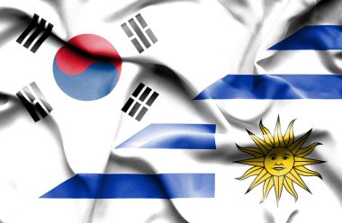 uruguay ve Güney Kore bayrağı sallayarak