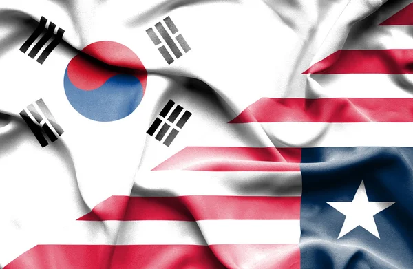 リベリアと韓国の旗を振っています。 — ストック写真