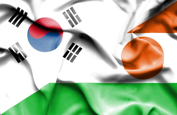 Bandiera sventolante di Niger e Corea del Sud — Foto Stock