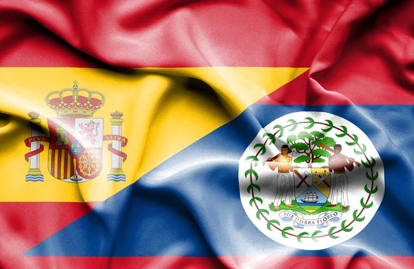 Bandera ondeante de Belice y España — Foto de Stock