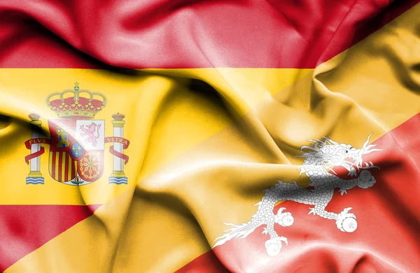 Waving flag of Bhutan and Spain — Stock Photo, Image