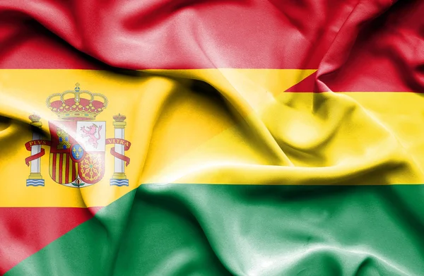 Mávání vlajky Bolívie a Španělsko — Stock fotografie