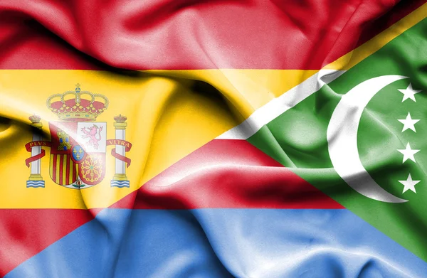 Waving flag of Comoros and Spain — Stock Photo, Image