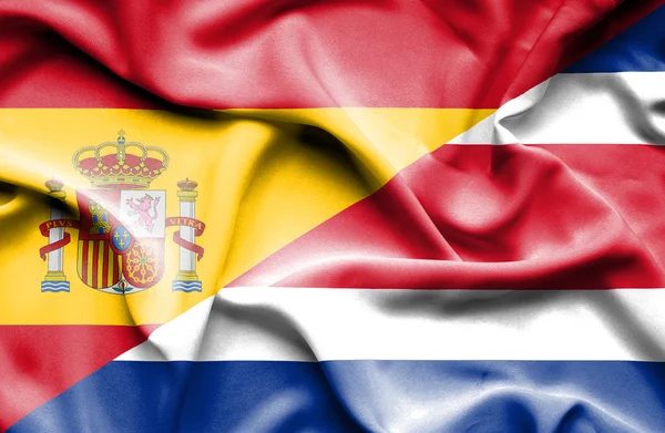 Waving flag of Costa Rica and Spain — Stock Photo, Image