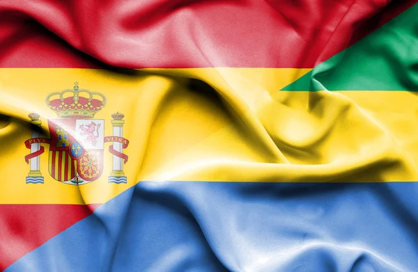 Vlající vlajka Gabonu a Španělsko — Stock fotografie