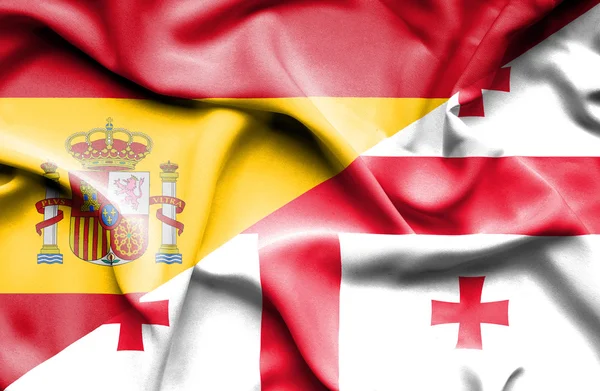 Vlající vlajka Gruzie a Španělsko — Stock fotografie