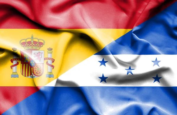 Waving flag of Honduras and Spain — Stock Photo, Image