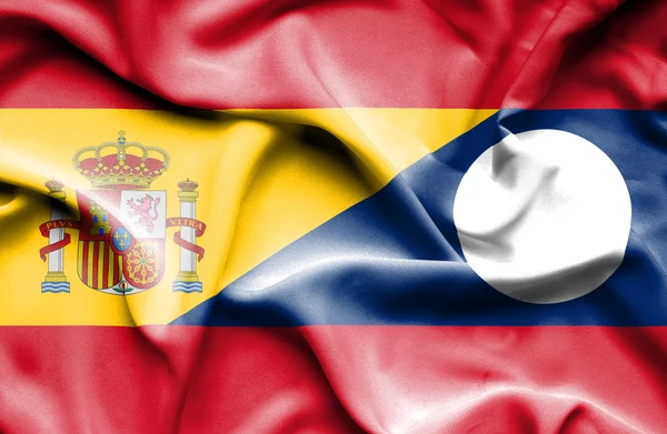 Sventolando bandiera del Laos e della Spagna — Foto Stock