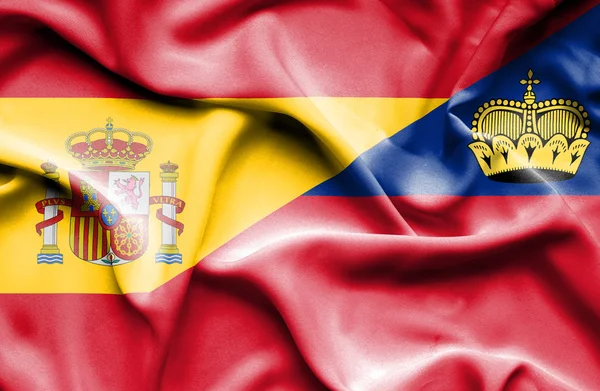 Flagge von Lichtenstein und Spanien schwenken — Stockfoto