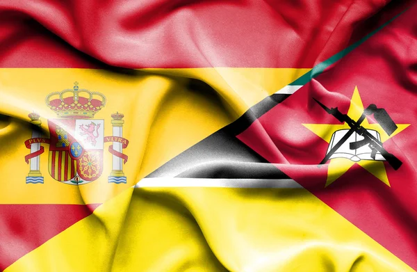 Vlající vlajka Mosambiku a Španělsko — Stock fotografie