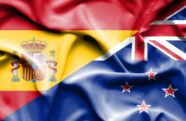 Waving flag of New Zealand and Spain — Stock Photo, Image