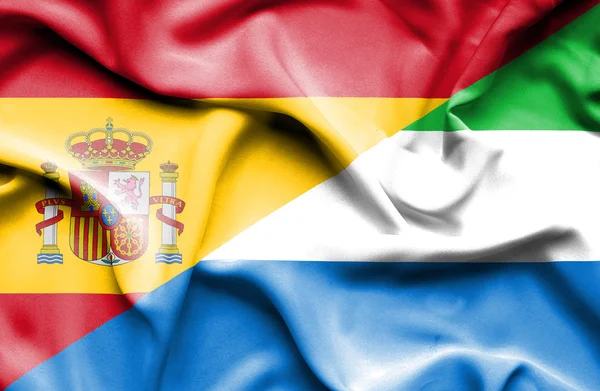 Waving flag of Sierra Leone and Spain — Stock Photo, Image