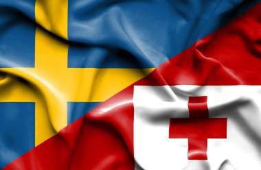tonga ve İsveç bayrağı sallayarak