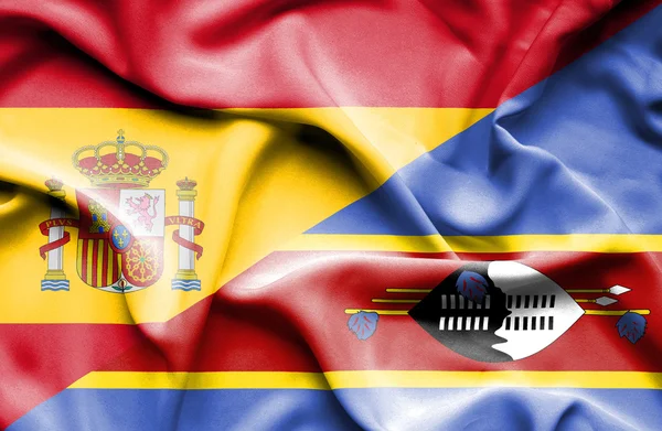 Macha flagą swazliand i Hiszpanii — Zdjęcie stockowe