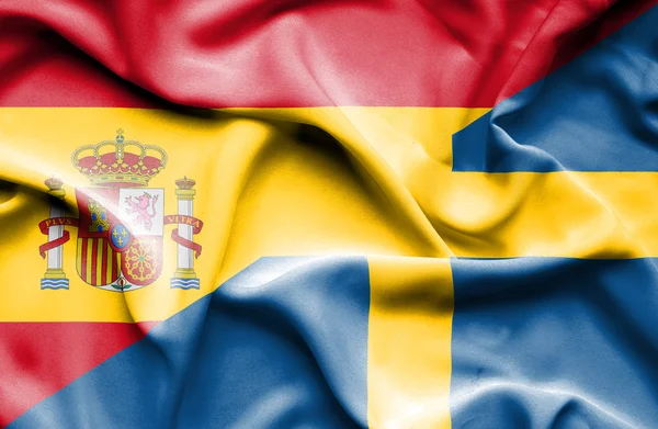 Waving flag of Sweden and Spain — Stock Photo, Image