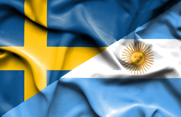 アルゼンチンとスウェーデンの旗を振っています。 — ストック写真