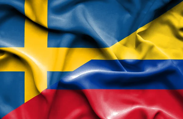 Viftande flagga columbia och Sverige — Stockfoto