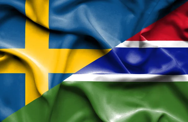 Viftande flagga gambia och Sverige — Stockfoto