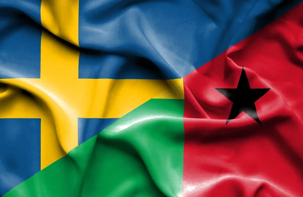 Sventolando bandiera della Guinea Bissau e della Svezia — Foto Stock