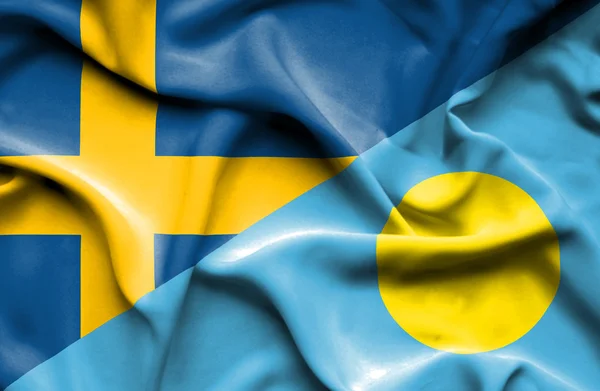 Waving flag of Palau and Sweden — Stock Photo, Image