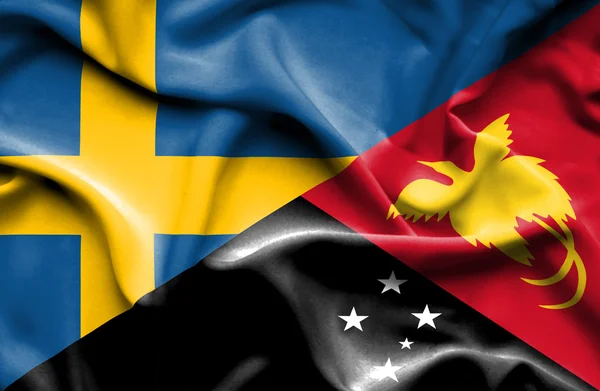 Bandeira acenando de Papua Nova Guiné e Suécia — Fotografia de Stock